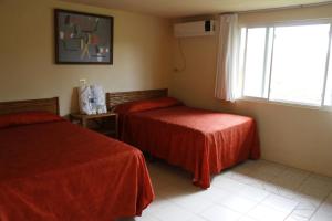 Voodi või voodid majutusasutuse Hotel Carrizal Spa toas