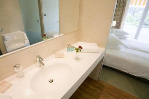 Кровать или кровати в номере Hotel Kimen
