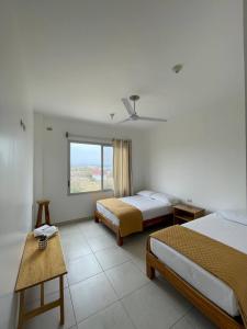 Voodi või voodid majutusasutuse Samana Hostal, Puerto Engabao toas