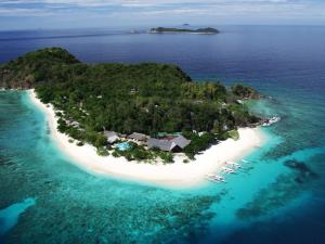 an aerial view of an island in the ocean at Club Paradise Resort Palawan in Coron
