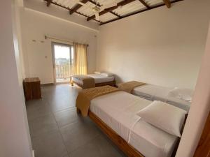 Voodi või voodid majutusasutuse Samana Hostal, Puerto Engabao toas