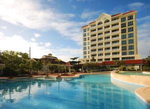 a large swimming pool in front of a hotel at Sotogrande Hotel and Resort in Cebu in Mactan