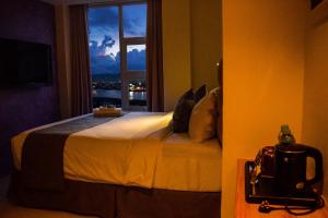 Letto o letti in una camera di Sempre Premier Inn - MACTAN AIRPORT HOTEL