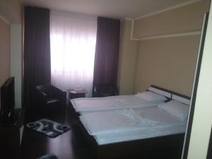 Postel nebo postele na pokoji v ubytování Vila Crinul
