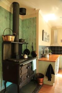 Kuchyň nebo kuchyňský kout v ubytování Blackfern cottage