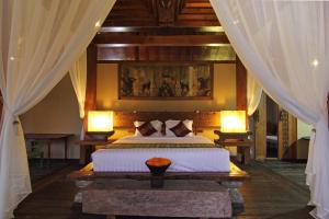 Cama o camas de una habitación en Villa Uma Priyayi