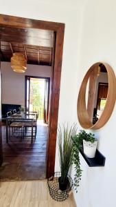 a dining room with a table and a mirror at Lina House Garden, BBQ & Outdoor Dining in Puntagorda +13 photos
