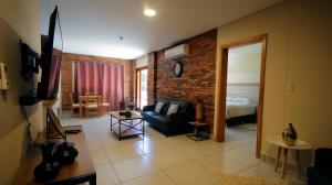 Predel za sedenje v nastanitvi Aparthotel Los Laureles
