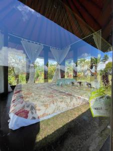 Ένα ή περισσότερα κρεβάτια σε δωμάτιο στο Bugo Camp, Glamping & Natural Activity