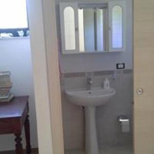 a bathroom with a sink and a mirror at Oasi delle Madonie in Scillato