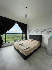 a bedroom with a large bed with a large window at Sandakan Homestay Sea-Forest View Apartment 2R2B 海森雙景公寓 in Sandakan