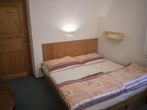Postel nebo postele na pokoji v ubytování Apartmany Harrachov