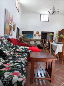 a living room with a couch and a table at Casa Palmeral in Mácher