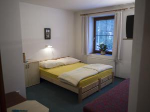 Postel nebo postele na pokoji v ubytování Apartmany Harrachov