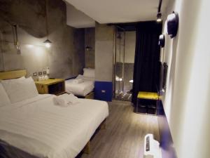 Postel nebo postele na pokoji v ubytování Just Inn 正旅館 台北車站