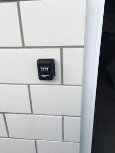 a clock on a white tiled wall at Lakeview Terrace Accommodation in Cromwell
