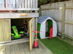 a play house with some toys in it at Kentish Barn Retreat in Chilham