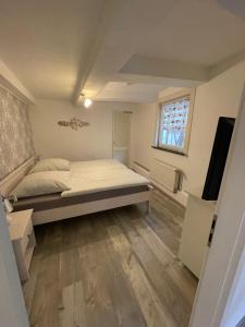 Postel nebo postele na pokoji v ubytování Apartment A6 Goslar am Marktplatz