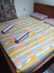 Postel nebo postele na pokoji v ubytování Discovery Youth Hostel Malacca