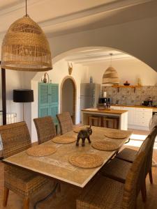 a bear toy on a table in a kitchen at Villa Azafran in Málaga