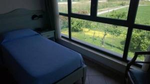 Voodi või voodid majutusasutuse Albergo del Po toas