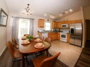 a kitchen and dining room with a table and chairs at Great Community, Amazing Private Pool, Near Disney! in Davenport