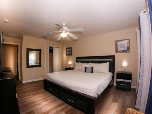 a bedroom with a bed and a ceiling fan at Great Community, Amazing Private Pool, Near Disney! in Davenport +27 photos