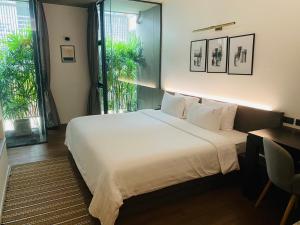 Ένα ή περισσότερα κρεβάτια σε δωμάτιο στο T2 Residence Sathorn +72 φωτογραφίες