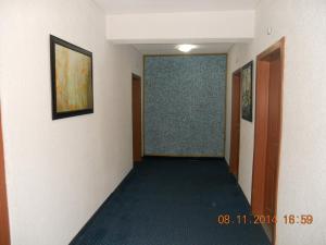 a hallway with a hallway leading into a room at Family Hotel Helios in Sevlievo