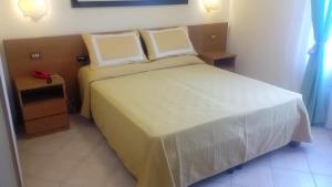 Postel nebo postele na pokoji v ubytování Hotel Astor Victoria