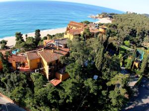 an aerial view of a house next to the beach at Rigat Park & Spa Hotel - Adults Recommended in Lloret de Mar