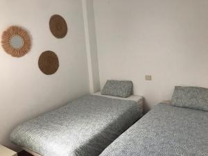 A bed or beds in a room at Canteras Home