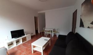 A television and/or entertainment centre at Canteras Home Még 3 kép