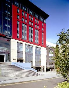 a red building with stairs in front of it at Malmaison Birmingham in Birmingham