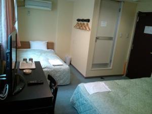 Кровать или кровати в номере City Inn Nishi Tanabe