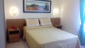 Postel nebo postele na pokoji v ubytování Hotel Astor Victoria