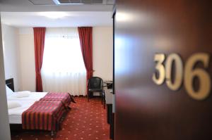 Postel nebo postele na pokoji v ubytování Hotel Roberts