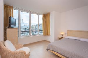 Posteľ alebo postele v izbe v ubytovaní Casa Port Grec