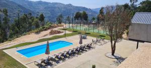 an aerial view of a swimming pool at a resort at Quinta de Cabanas Douro - By Unlock Hotels in Penha Longa