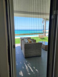 a view of a living room with a view of the ocean at Villa Gentile in Eraclea Minoa