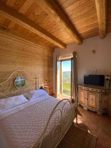 Posteľ alebo postele v izbe v ubytovaní Cascina Maina
