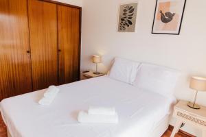 Cama o camas de una habitación en Apartamento Santos Pousada