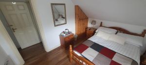 A bed or beds in a room at Lough Rynn View Accommodation Accommodation - Room only
