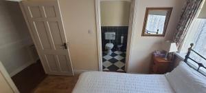 A bed or beds in a room at Lough Rynn View Accommodation Accommodation - Room only