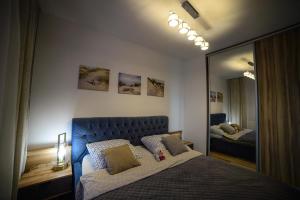 Posteľ alebo postele v izbe v ubytovaní Apartamenty Via Marina