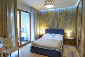 Posteľ alebo postele v izbe v ubytovaní Apartamenty Via Marina