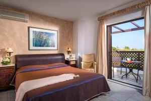 A bed or beds in a room at Hersonissos Maris