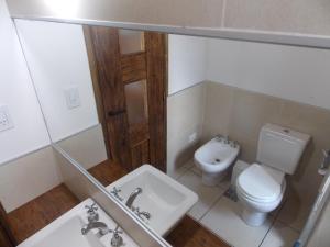 a small bathroom with a toilet and a sink at Chalet Vista Montana in Potrerillos