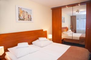 Postel nebo postele na pokoji v ubytování Hotel IKAR