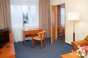 TV a/nebo společenská místnost v ubytování Hotel IKAR